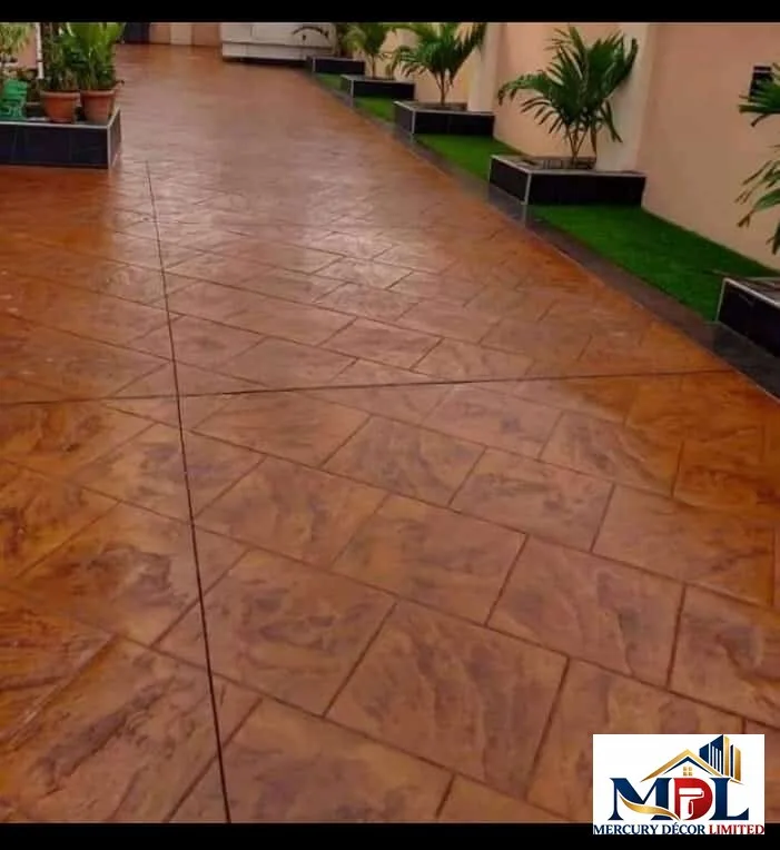 A terracotta stamped-concrete patio with a patterned surface.